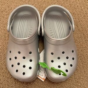 NWT. Crocs slip on clogs. Size J2